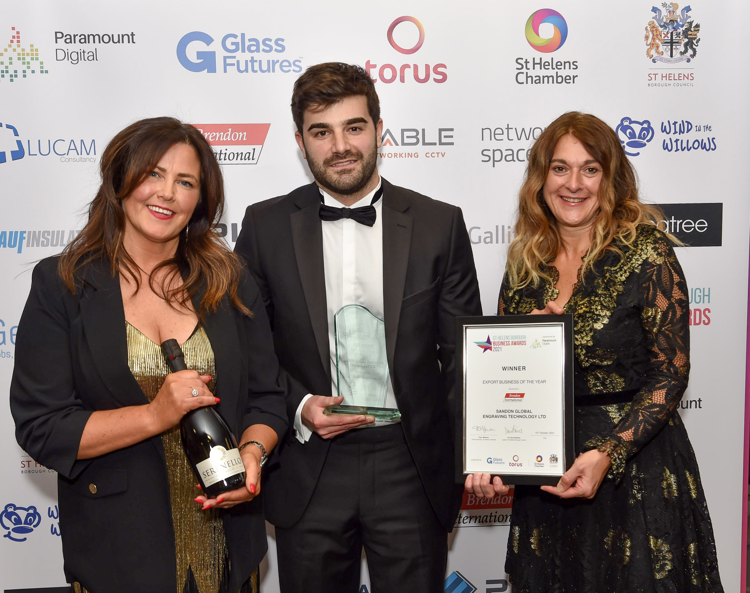 Pictured left to right_Sue Fitzmaurice and Jake Roberts accepting the award on behalf of Sandon Global. Presented by a representative from St. Helens Chamber
